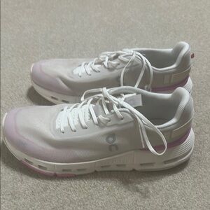 On Running White and Pink Athletic Shoes with Minimalist Design